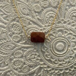 Goldstone necklace with 18” gold plated chain.  New.